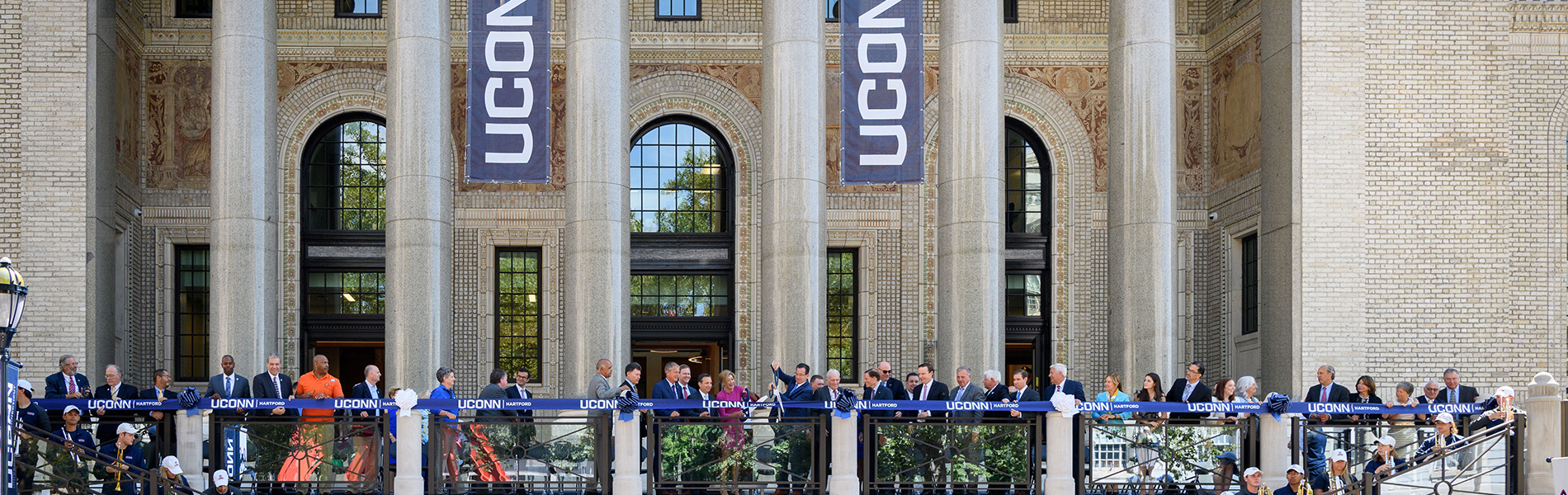 Governor Dannel Malloy, President Susan Herbst and other dignitaries cut the ribbon to open the Hartford campus on Aug. 23, 2017. (Peter Morenus/UConn Photo)